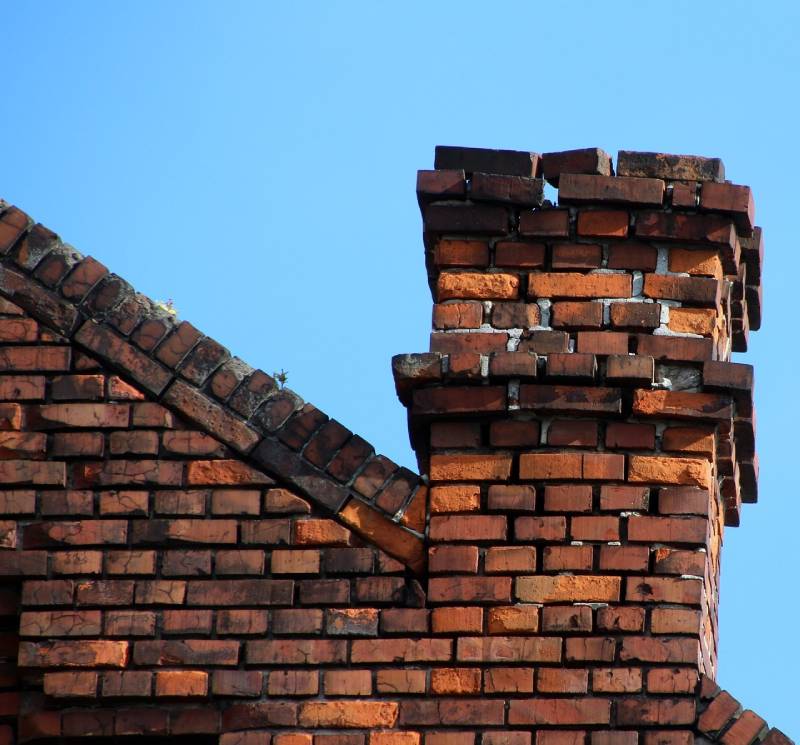 Signs Your Lancaster Home Needs a Chimney Inspection Damaged chimney on an Lancaster home showing cracks and missing mortar